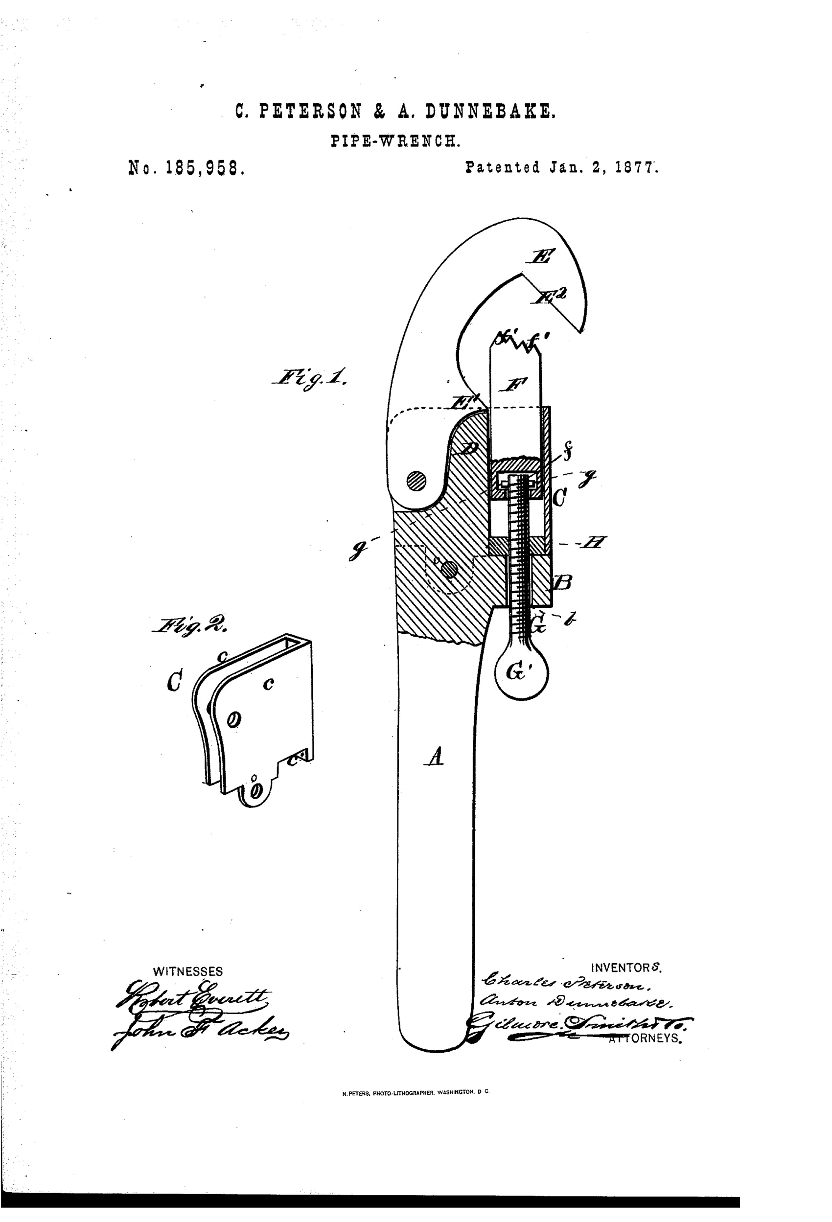 Patent drawing of a pipe wrench showing a long handle A with a hooked jaw E at the top pivoted in a casing C, a sliding straight jaw F with knurled ridges, an adjusting screw rod G with a round thumb-piece G' below, and a separate detail view (Fig. 2) of the casing bracket with recesses c c.